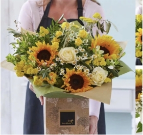 Sunflower hand tied bouquet made with the finest yellow and white flowers